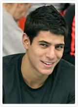 A young man smiling for the camera.