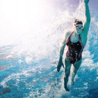 A woman in black bathing suit swimming on top of water.