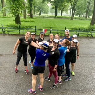 A group of people standing in the street.