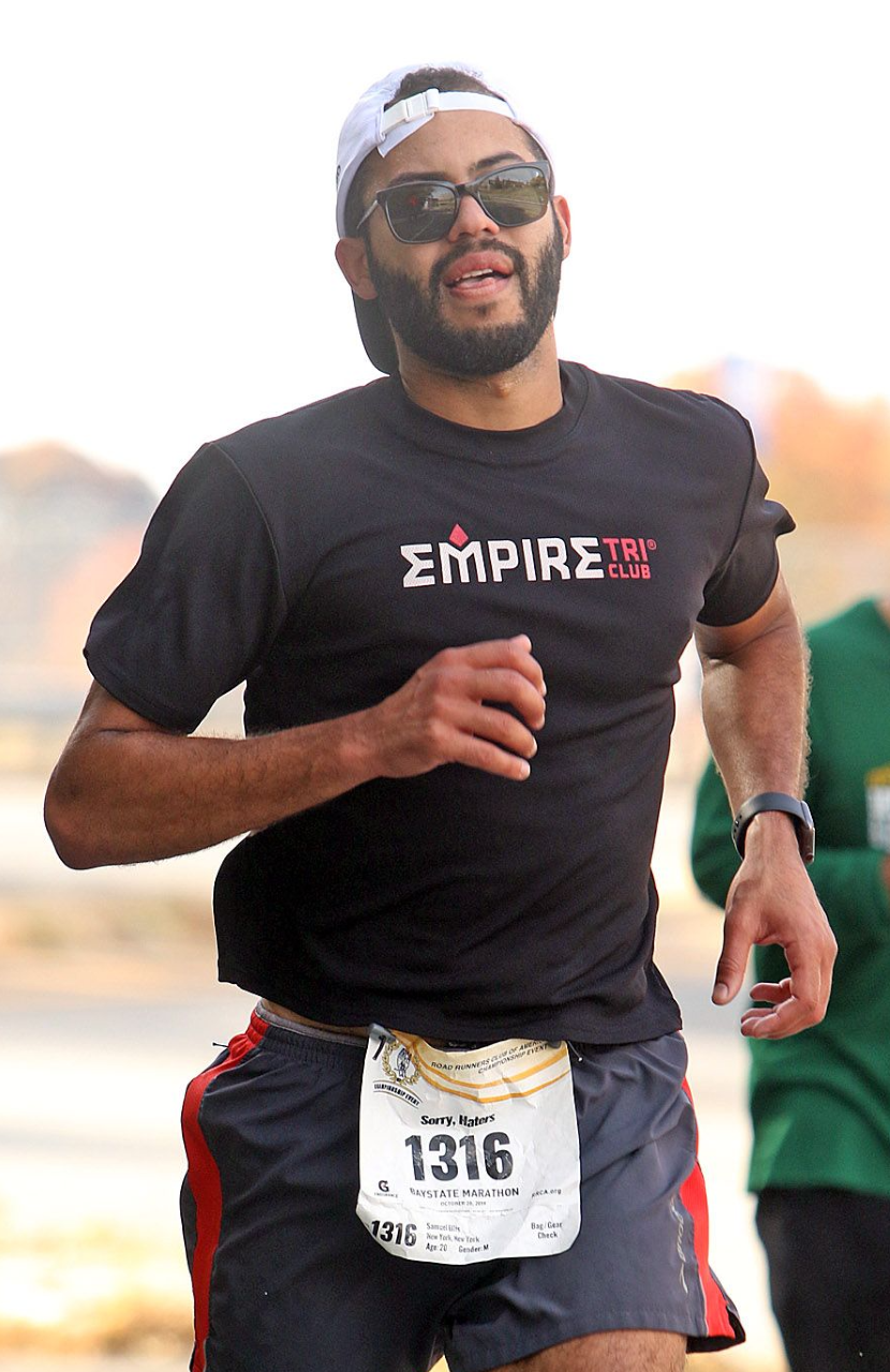 A man running in the middle of a race.